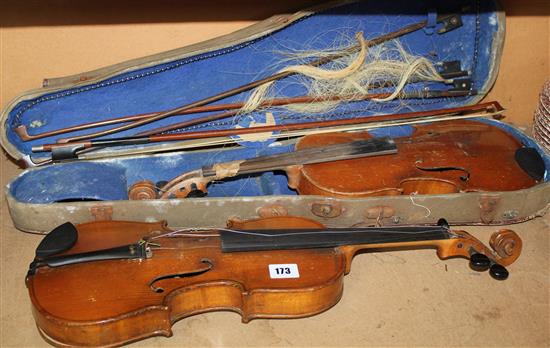 Cased violin, another & violin bows